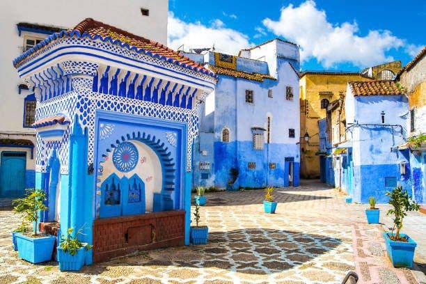 Blue-tiled fountain and blue houses in Chefchaouen